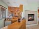 Wet bar adjacent to a fireplace and a view of the house's interior and backyard through multiple windows at 1105 Malachite Ct, Henderson, NV 89011