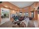 Open living room featuring a fireplace, plush seating, and seamless access to the outdoor patio at 1105 Malachite Ct, Henderson, NV 89011