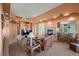 Spacious living room featuring a fireplace, comfortable seating, and an open layout to the kitchen at 1105 Malachite Ct, Henderson, NV 89011