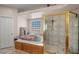 Main bathroom featuring a soaking tub with jets and a glass-enclosed shower at 1105 Malachite Ct, Henderson, NV 89011