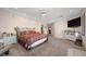 Large main bedroom with a ceiling fan, dresser, and ensuite bathroom at 1105 Malachite Ct, Henderson, NV 89011