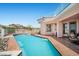 Beautiful backyard pool area with lush landscaping, mountain views, and a relaxing outdoor space at 1105 Malachite Ct, Henderson, NV 89011