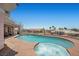 Luxurious backyard featuring a pool, spa, and outdoor entertaining area with panoramic views at 1105 Malachite Ct, Henderson, NV 89011