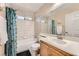 Well-maintained bathroom with tiled shower/tub, light vanity, and updated fixtures at 1116 Avellino Ln, Las Vegas, NV 89144