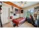 Comfortable bedroom with a cozy bed, personal decorations, and natural light from the window at 1116 Avellino Ln, Las Vegas, NV 89144