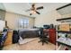 Spacious bedroom with a ceiling fan, natural light, and ample space for relaxation at 1116 Avellino Ln, Las Vegas, NV 89144