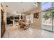 Bright dining area with sliding doors, seamlessly connecting indoor and outdoor spaces at 1116 Avellino Ln, Las Vegas, NV 89144