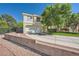 Charming two-story home with a well-kept lawn, concrete driveway, and tasteful landscaping and rock decorations at 1116 Avellino Ln, Las Vegas, NV 89144