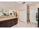 Kitchen with tiled floors and countertops offering direct access to the living and dining areas at 1116 Avellino Ln, Las Vegas, NV 89144