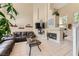 Spacious living room featuring a fireplace, large windows, and comfortable seating at 1116 Avellino Ln, Las Vegas, NV 89144