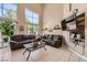 Inviting living room with high ceilings, large windows, and comfortable leather sofas at 1116 Avellino Ln, Las Vegas, NV 89144