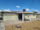 View of backyard from the back of the house featuring a covered patio and a gravel area at 129 Maple St, Henderson, NV 89015
