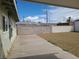 Exterior view of a large backyard with a block wall and gravel ground cover at 129 Maple St, Henderson, NV 89015