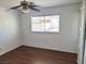 A well-lit bedroom features wood floors and a window, providing natural light and ventilation at 129 Maple St, Henderson, NV 89015
