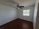 A well-lit bedroom features wood floors and a window, providing natural light and ventilation at 129 Maple St, Henderson, NV 89015