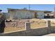 Charming single-story home with a rock-landscaped front yard, carport, and neutral color palette at 129 Maple St, Henderson, NV 89015