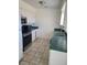 Functional kitchen with stainless steel appliances, including a microwave, oven, and double-basin sink at 129 Maple St, Henderson, NV 89015