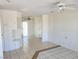 Spacious living area with tile flooring, neutral walls, built-in shelving and access to the backyard at 129 Maple St, Henderson, NV 89015