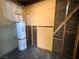 Unfinished storage space featuring a new water heater at 129 Maple St, Henderson, NV 89015