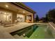 Backyard featuring a pool with covered patio and outdoor furniture at 15 Reflection Bay Dr, Henderson, NV 89011