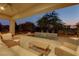 Covered patio featuring outdoor seating and a small water feature at 15 Reflection Bay Dr, Henderson, NV 89011