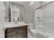 Bathroom with shower, wood cabinets, sink, and tiled floors at 15 Reflection Bay Dr, Henderson, NV 89011