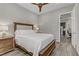 Bedroom with a king-sized bed, wood flooring, and connecting to other rooms in the house at 15 Reflection Bay Dr, Henderson, NV 89011