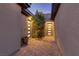 Courtyard area featuring brick pavers, a tree, and doors leading to the home's interior at 15 Reflection Bay Dr, Henderson, NV 89011