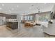 Open-concept living space featuring wood flooring, neutral tones, and a seamless flow at 15 Reflection Bay Dr, Henderson, NV 89011