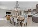 Open-concept layout featuring living room, dining area, and a modern kitchen at 15 Reflection Bay Dr, Henderson, NV 89011