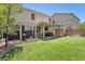 Spacious backyard featuring a pergola with an outdoor kitchen and patio area for entertaining at 184 Bird Cove Ave, Henderson, NV 89011