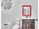 Stylish half-bathroom with wood-look vanity and modern fixtures at 184 Bird Cove Ave, Henderson, NV 89011