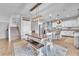 Cozy dining area with a wooden table and seating, adjacent to a modern kitchen at 184 Bird Cove Ave, Henderson, NV 89011