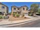 Inviting two-story home with gravel landscaping and a driveway leading to an attached garage at 184 Bird Cove Ave, Henderson, NV 89011