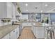 Bright, modern kitchen with white cabinets, granite countertops, and stainless steel appliances at 184 Bird Cove Ave, Henderson, NV 89011