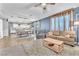 Open-concept living area seamlessly connects kitchen, dining, and living spaces with stylish furnishings at 184 Bird Cove Ave, Henderson, NV 89011