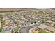 Wide aerial view of houses with solar panels and desert landscaping in a well-maintained residential neighborhood at 184 Bird Cove Ave, Henderson, NV 89011