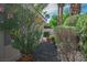 Landscaped backyard with decorative pots and mature plants at 1978 Kachina Mountain Dr, Henderson, NV 89012