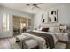 Bright bedroom featuring modern furnishings, stylish decor, and a sliding door to the outside at 1978 Kachina Mountain Dr, Henderson, NV 89012