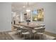 This dining area has wood floors and a marble dining table with seating for eight at 1978 Kachina Mountain Dr, Henderson, NV 89012