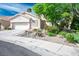 Charming single-story home featuring stucco exterior, tile roof, and well-manicured desert landscaping at 1978 Kachina Mountain Dr, Henderson, NV 89012