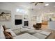 Living room featuring modern decor, a fireplace, hardwood floors, and an open layout at 1978 Kachina Mountain Dr, Henderson, NV 89012