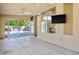 Large screened porch with ceiling fan, doors leading to the pool, and mounted television at 1978 Kachina Mountain Dr, Henderson, NV 89012