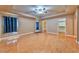 Bedroom with hardwood floors, tray ceiling and multiple doorways with closet space at 201 Palmarosa St, Henderson, NV 89015