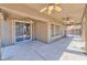 Spacious covered patio with ceiling fans, sliding glass doors, and access to a secure backyard gate at 201 Palmarosa St, Henderson, NV 89015