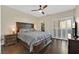 Comfortable bedroom featuring a ceiling fan, shutters, and access to a closet at 2050 W Warm Springs Rd # 823, Henderson, NV 89014