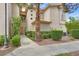 Inviting two-story townhouse showcasing manicured landscaping and a welcoming entrance at 2050 W Warm Springs Rd # 823, Henderson, NV 89014