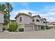 Exterior view of a modern townhome featuring multiple garage spaces and well-maintained landscaping at 2050 W Warm Springs Rd # 823, Henderson, NV 89014