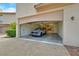 Spacious garage with epoxy floors, built-in cabinets, and a parked car inside at 2050 W Warm Springs Rd # 823, Henderson, NV 89014
