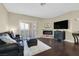 Inviting living room with fireplace, sliding doors to the outside, and stylish furnishings at 2050 W Warm Springs Rd # 823, Henderson, NV 89014